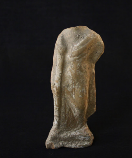 Figurine holding a stick